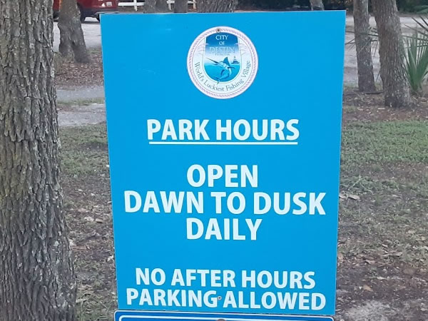 hours sign at clement taylor park in destin